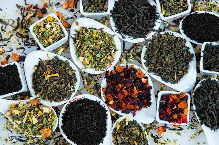 Assortment of dry tea. Various kinds of tea isolated on white.Different kinds of tea leaves. Tea composition with different kind of tea. Tea concept. Tea leaves