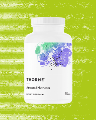thorne research vitamin bottle over green background