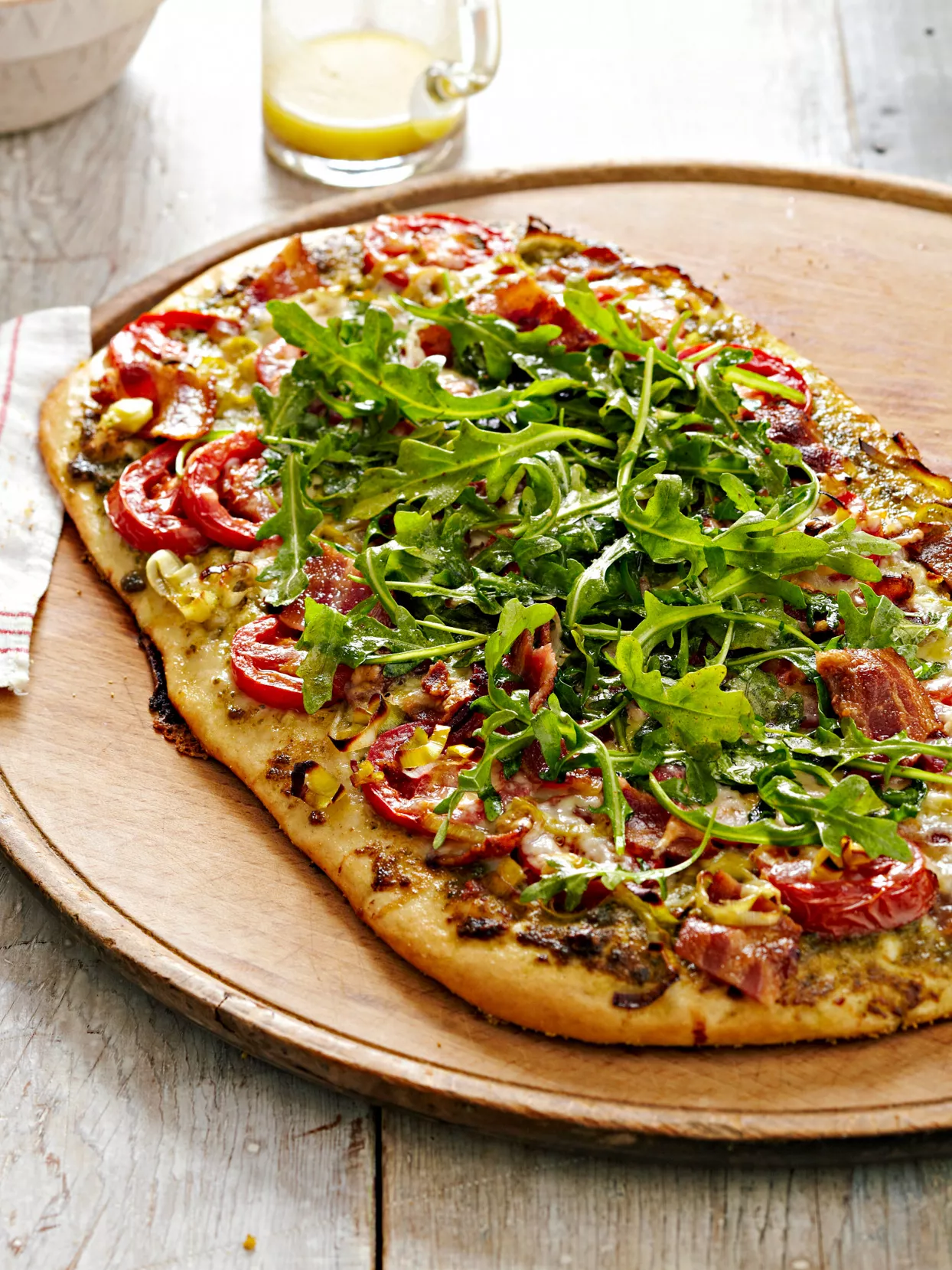 Pesto-Bacon-Tomato Pizza with Arugula Salad Topper